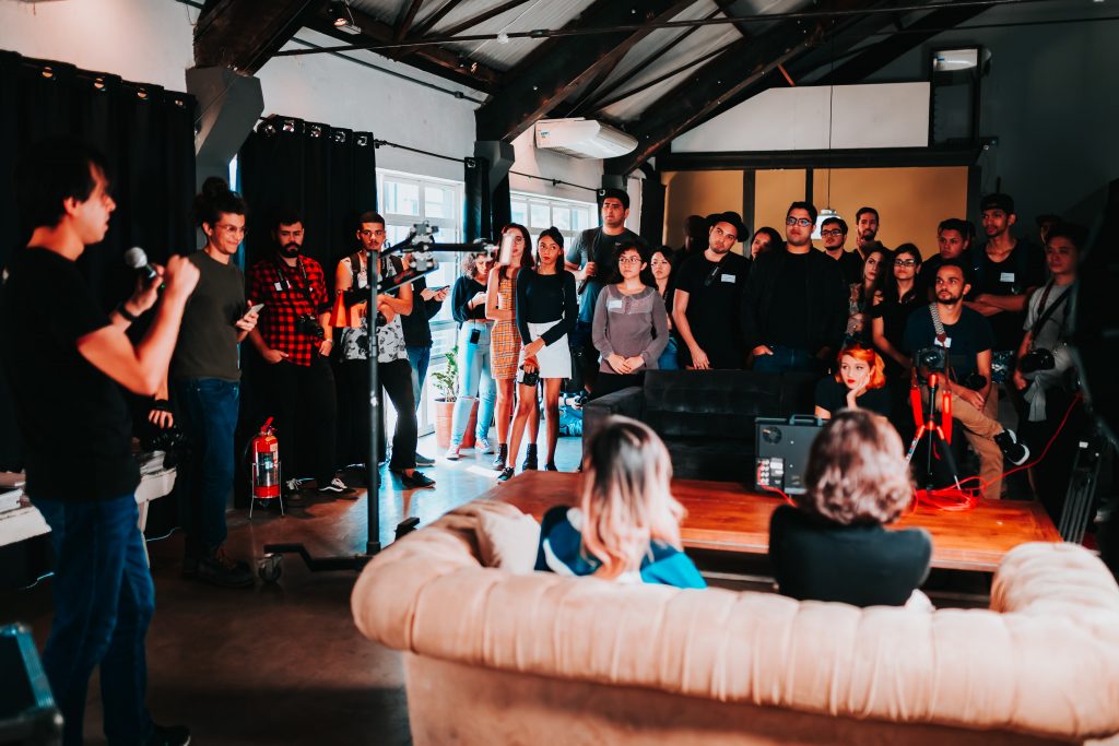 https://www.pexels.com/photo/group-of-people-standing-inside-room-2608517/