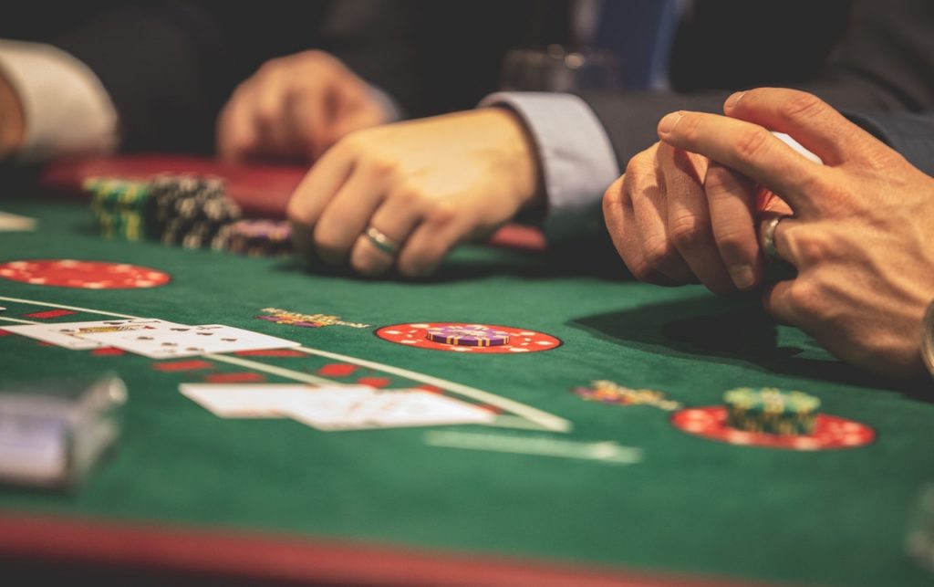 Gamification in apps can strongly influence usage. In it's pure sense, gamification can be used as a core social media app marketing tool. Image Source: https://www.pexels.com/photo/person-playing-poker-1871508/